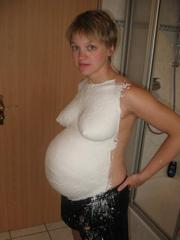 Pregnant blonde wife shows her naked body